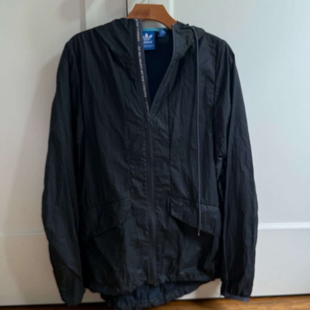 Adidas Men's Navy Hooded Jacket with printed trim, size small. Water resistant.